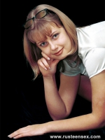 Teen blonde poses undressed