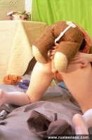 Teen blonde masturbates with her old bear toy