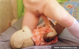 Teen blonde masturbates with her old bear toy