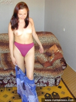 Russian teen brunette playing with her shaved pussy