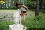 Teen pissing outdoor on a statue
