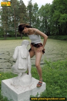Teen pissing outdoor on a statue