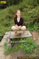 Pissing teen on the old table