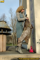 Outdoor pissing near graffiti
