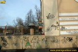 Outdoor pissing near graffiti