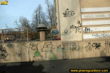 Outdoor pissing near graffiti