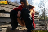 Teen brunette outdoor pissing in a suburb street