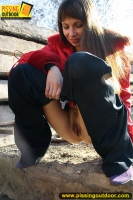 Teen brunette outdoor pissing in a suburb street