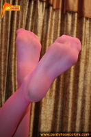 Magenta colored pantyhose look awesome on teen blonde