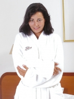Tan lines mature in white dressing-gown