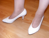 Slutty secretary in tights and white stilettos