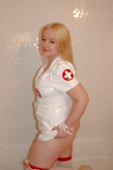 Chubby blonde posing as a nurse
