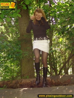 Teen blonde pisses on a log - N