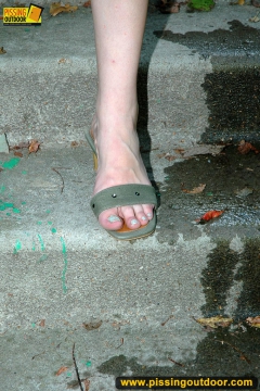 Outdoor pissing of teen brunette on a concrete park ladder - N
