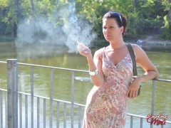 Amateur brunette babe Mina outdoor sexy smoke session - N