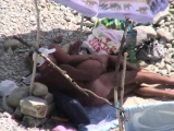 Mature couple enjoying sunny days on beach