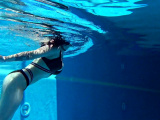 Big tits Sheril goes underwater naked