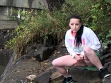 Raven Haired Girl Pees Near The River